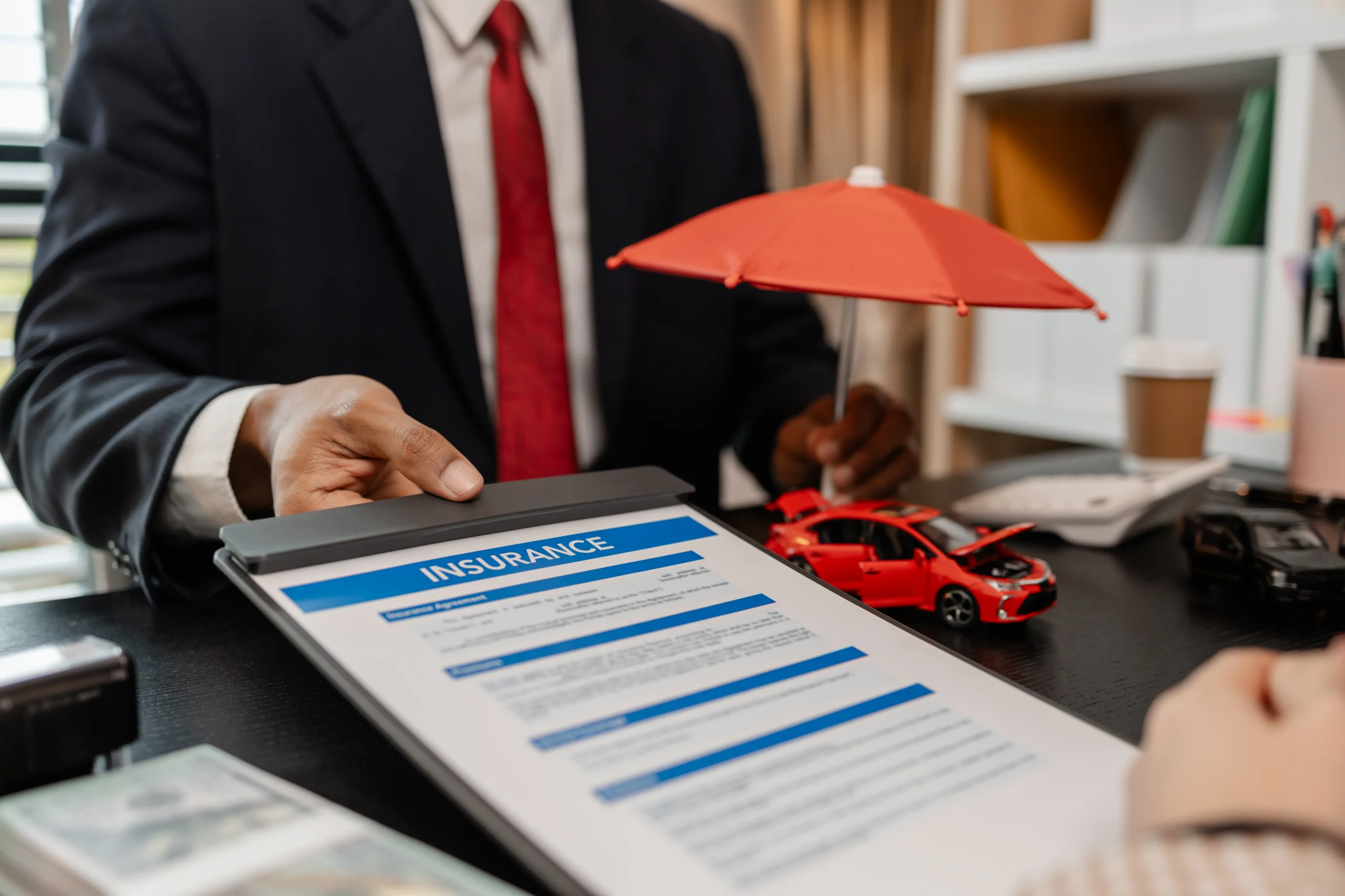 242503360_l a lawyer explains the details of a car insurance policy and all the costs to a client, a lawyer explains to a client what will happen if she dose not have car insurance